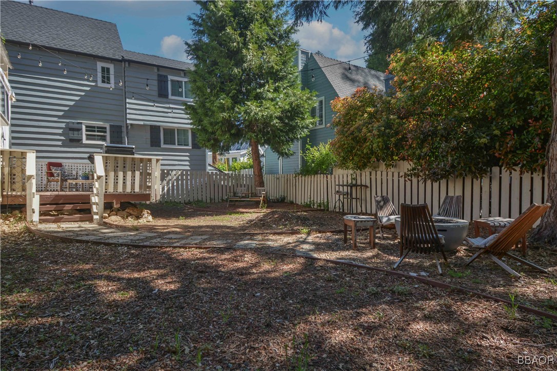 381 Maple Drive Lake Arrowhead, CA 92352 - Photo 18 of 26 a view of a chair and table in backyard