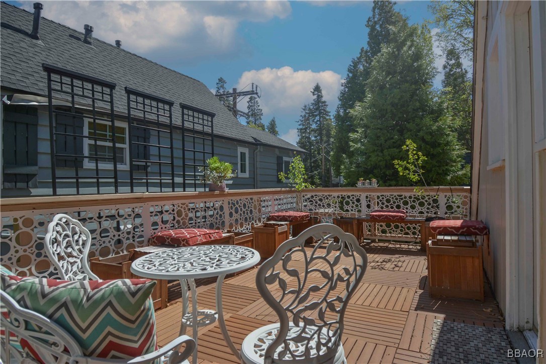 381 Maple Drive Lake Arrowhead, CA 92352 - Photo 24 of 26 a view of a chairs and table in the patio