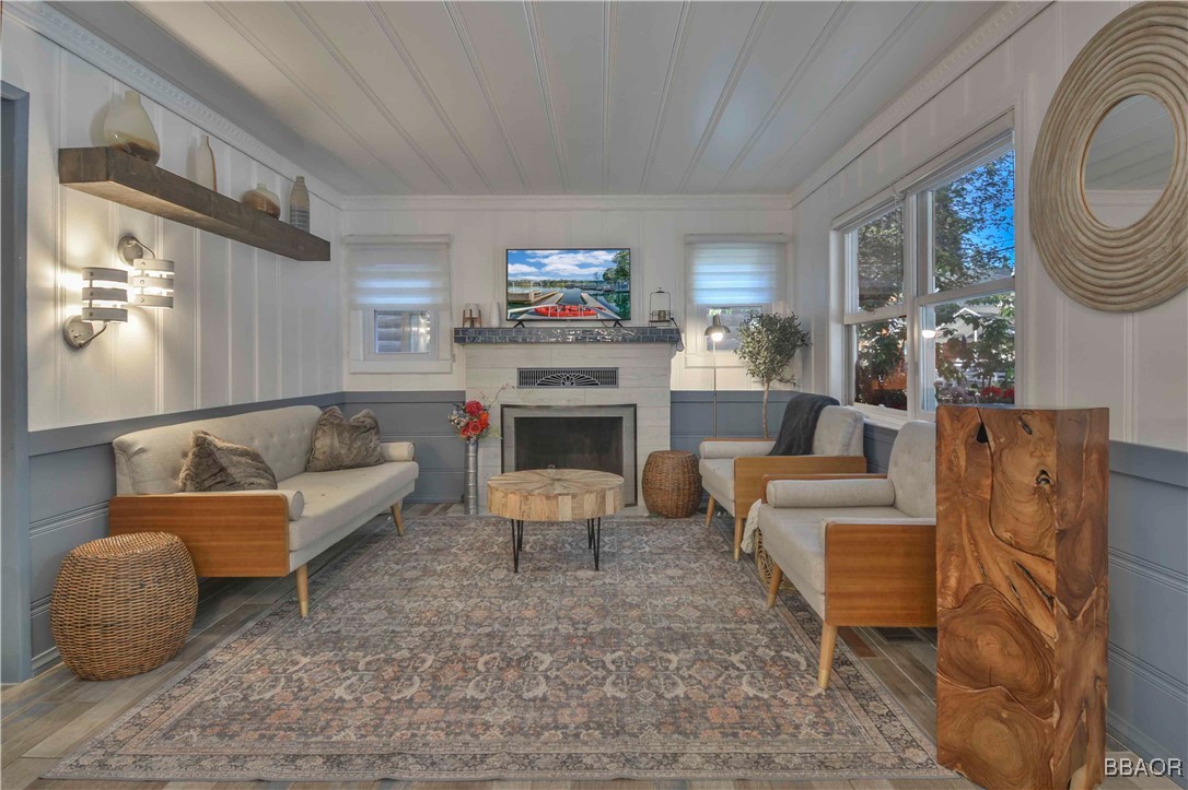 381 Maple Drive Lake Arrowhead, CA 92352 - Photo 7 of 26 a living room with furniture a flat screen tv and a fireplace