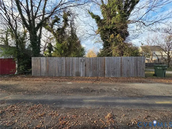 a view of outdoor space with wooden fence