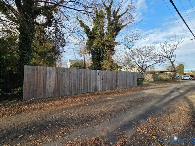 a view of outdoor space with wooden fence