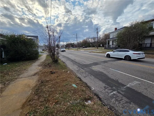 a view of street with parked cars