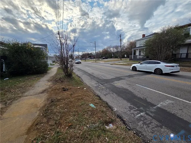 a view of street with parked cars