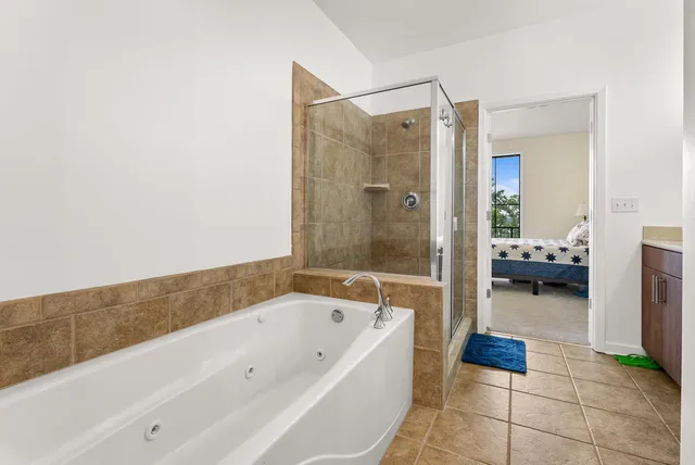 a bathroom with a bathtub and a shower