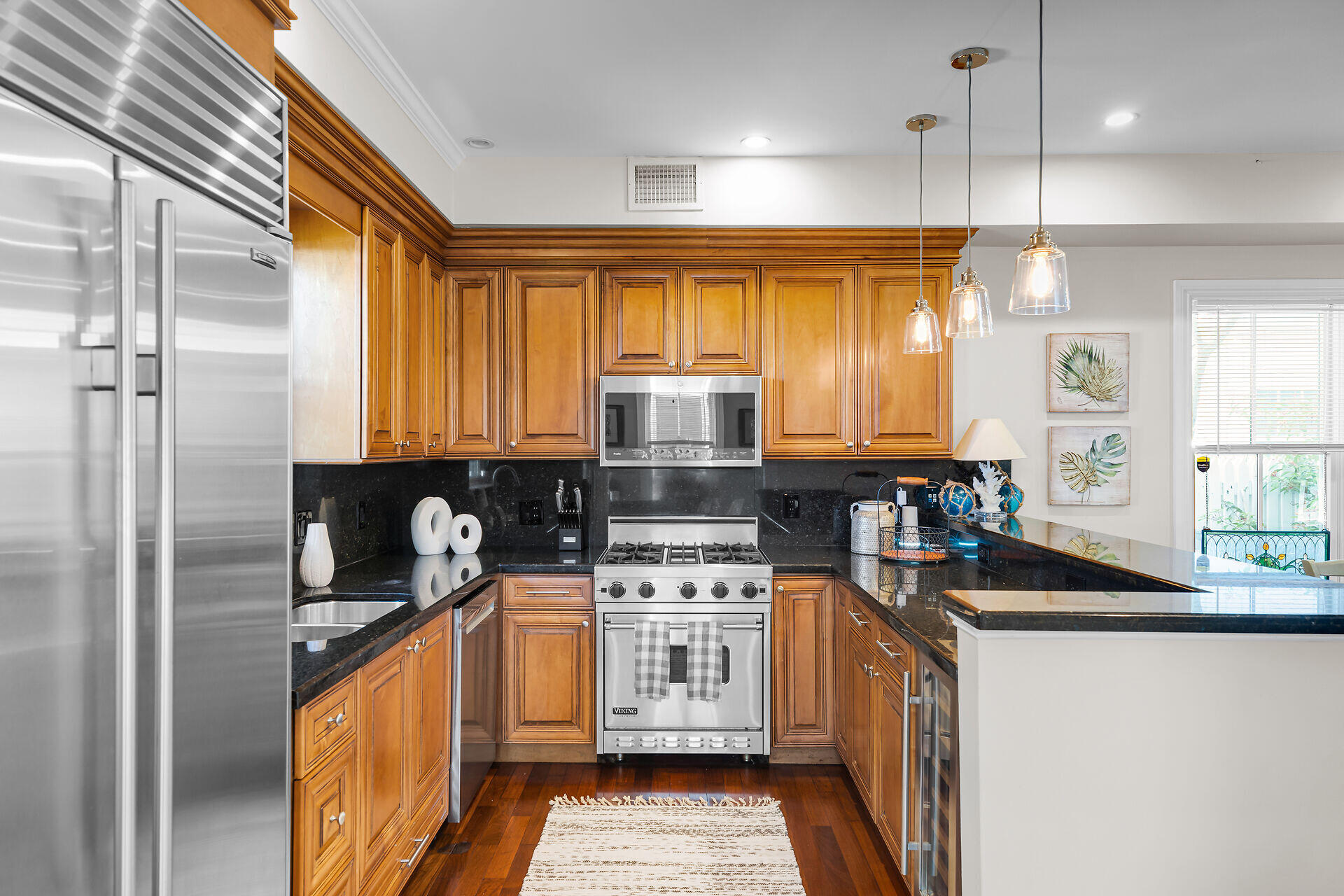 713 Emma Street, Unit 1 Key West, FL 33040 - Photo 14 of 42 a kitchen with stainless steel appliances granite countertop a stove a sink and a refrigerator