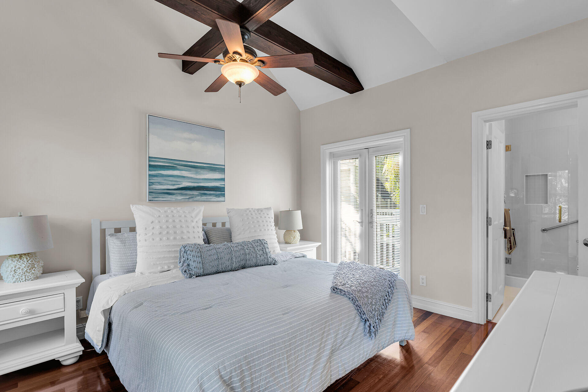 713 Emma Street, Unit 1 Key West, FL 33040 - Photo 23 of 42 a bedroom with a large bed and a chandelier