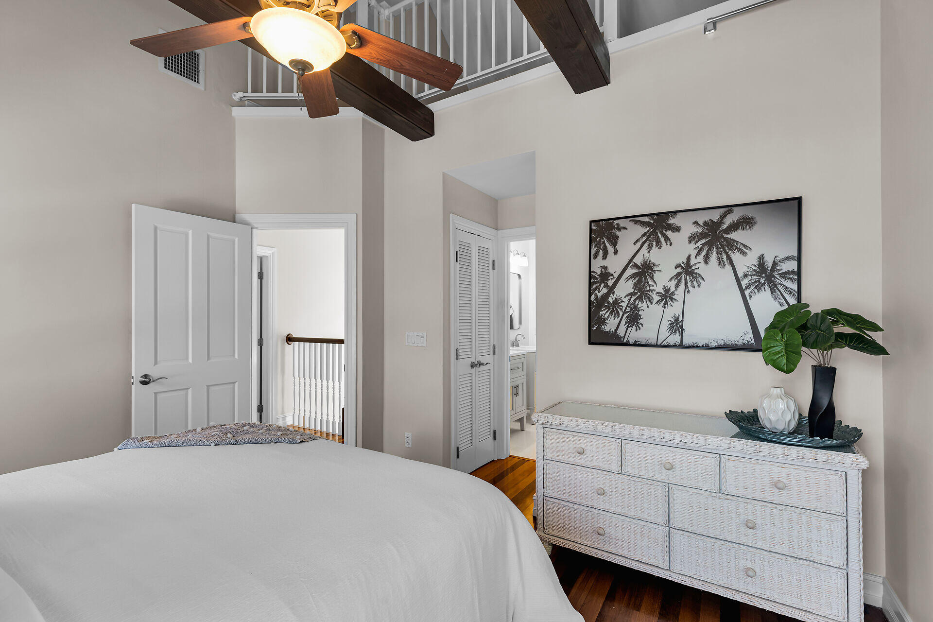 713 Emma Street, Unit 1 Key West, FL 33040 - Photo 29 of 42 a bedroom with a bed and a chandelier