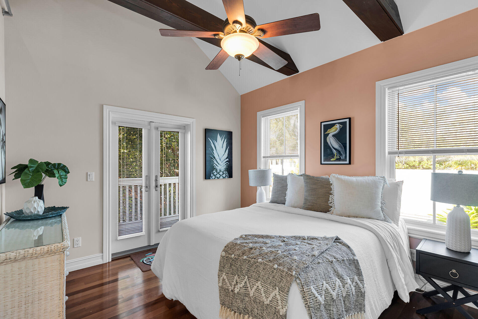 713 Emma Street, Unit 1 Key West, FL 33040 - Photo 5 of 42 a bedroom with a large bed chandelier and a window