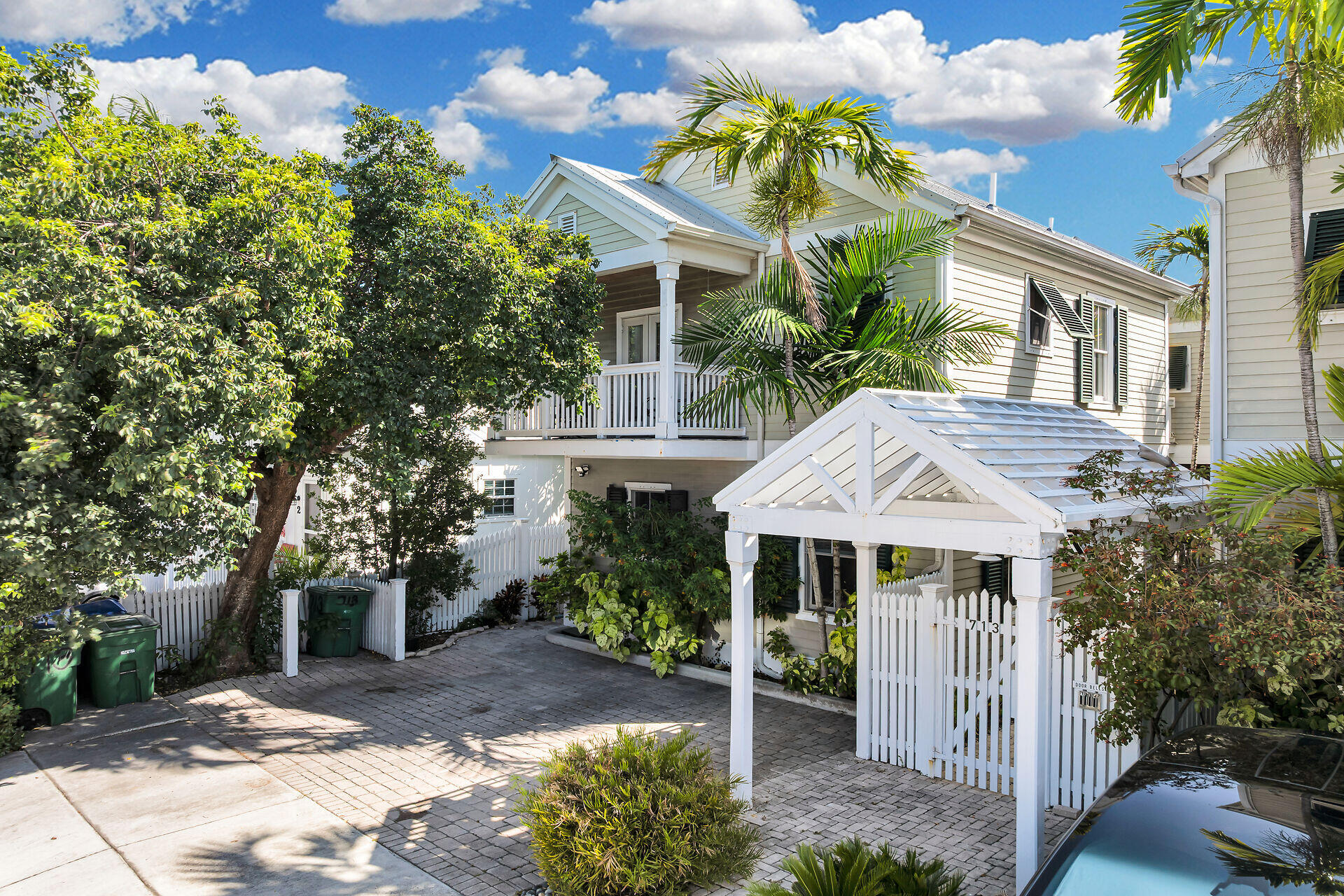 713 Emma Street, Unit 1 Key West, FL 33040 - Photo 6 of 42 a front view of a house with a yard