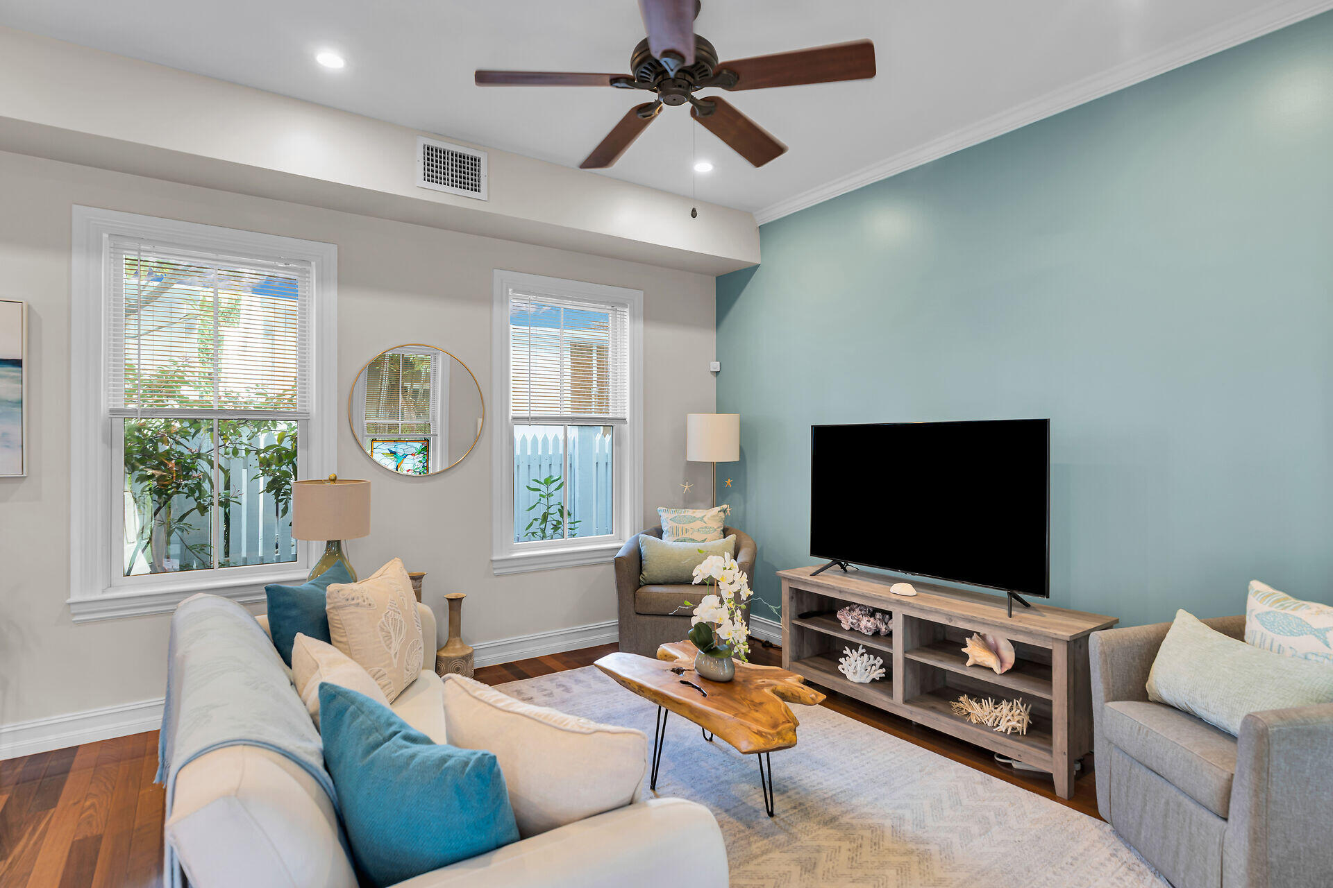 713 Emma Street, Unit 1 Key West, FL 33040 - Photo 9 of 42 a living room with furniture and a flat screen tv