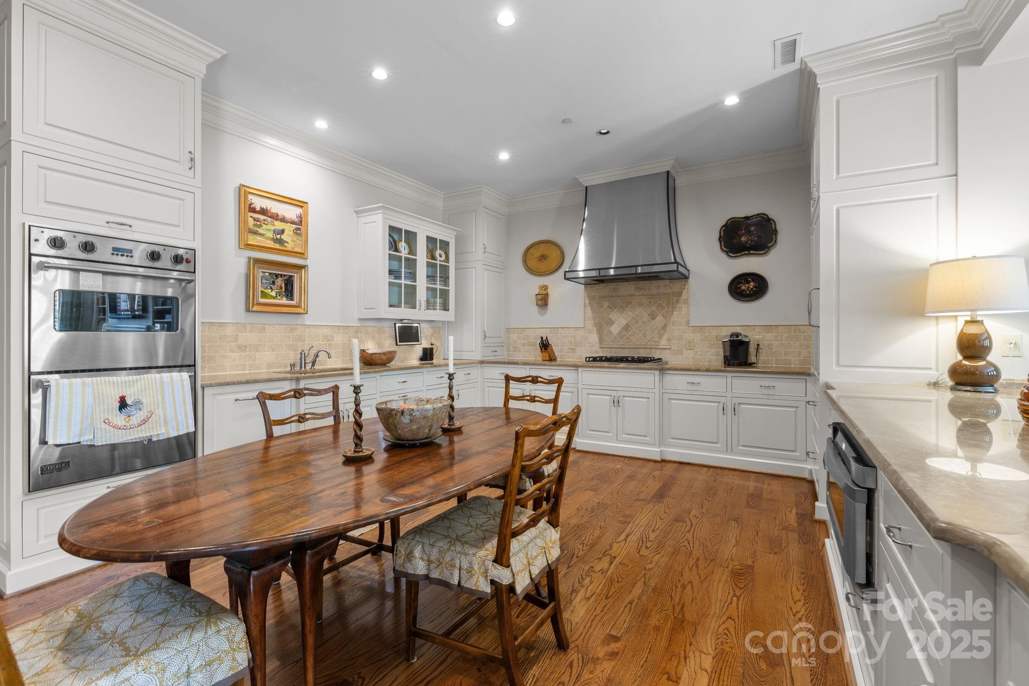 168 Cherokee Road Charlotte, NC 28207 - Photo 16 of 44 a large kitchen with a table and chairs