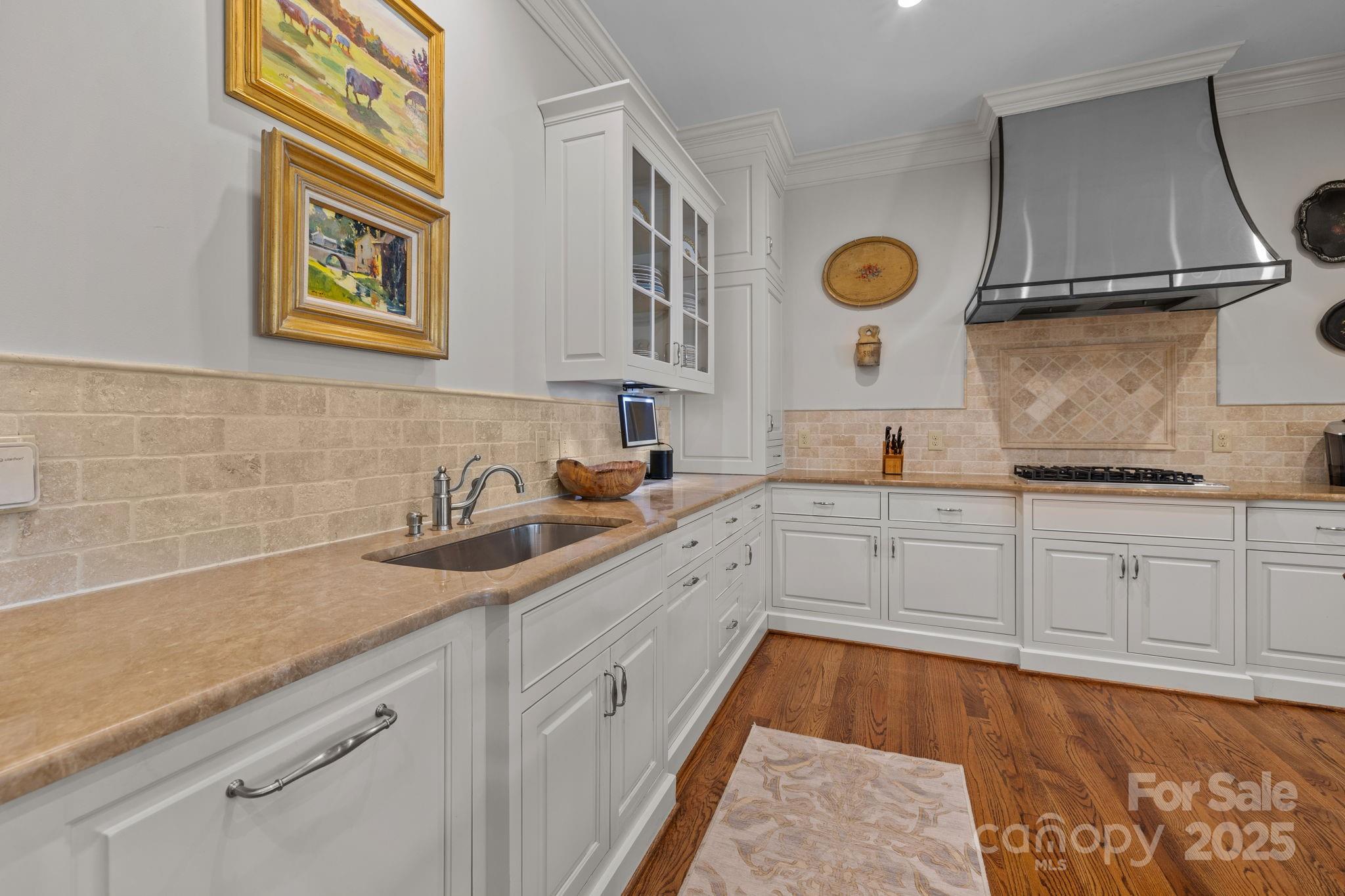 168 Cherokee Road Charlotte, NC 28207 - Photo 17 of 44 a kitchen with stainless steel appliances granite countertop a sink and a cabinets