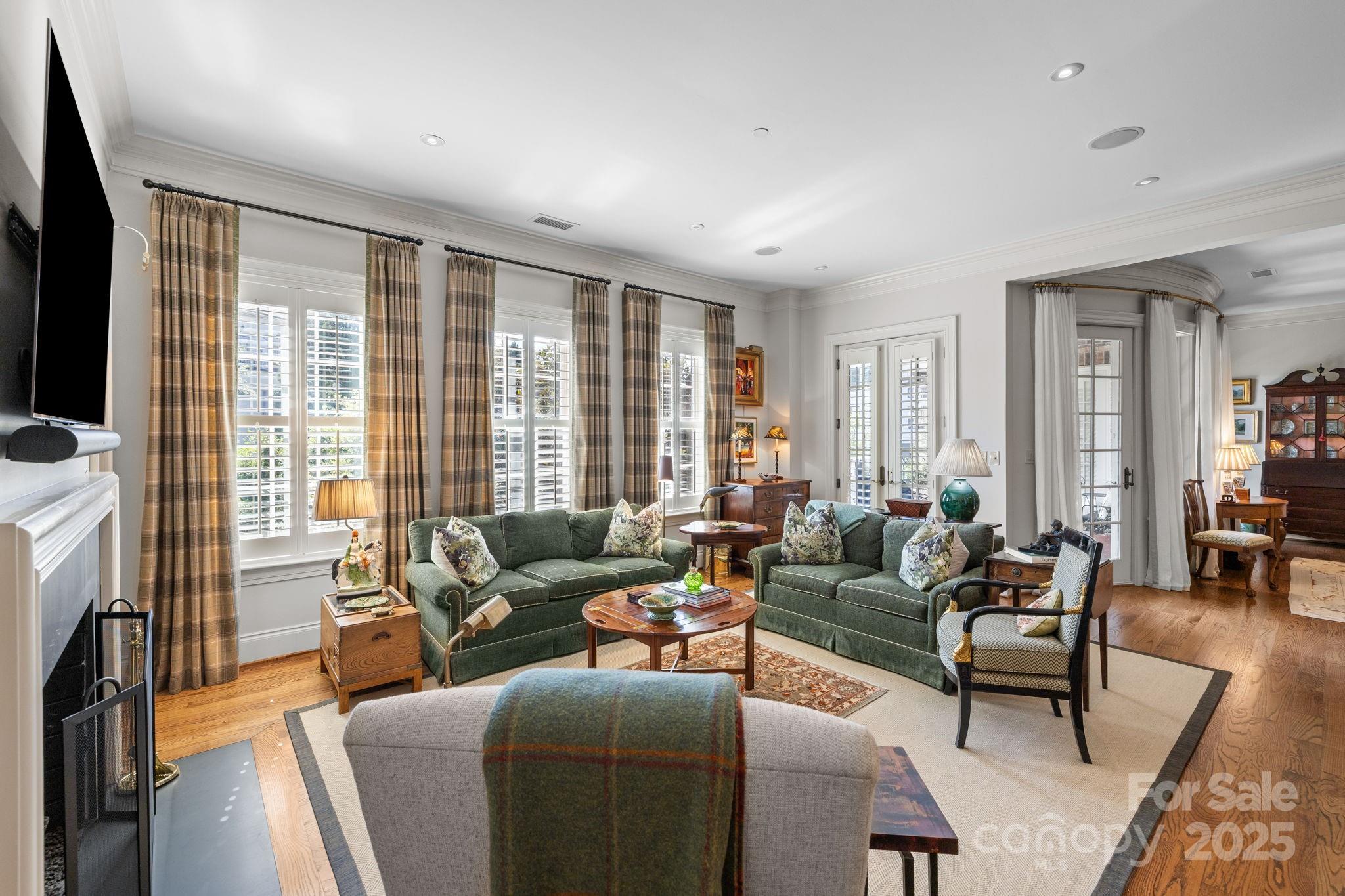 168 Cherokee Road Charlotte, NC 28207 - Photo 21 of 44 a living room with furniture and a flat screen tv