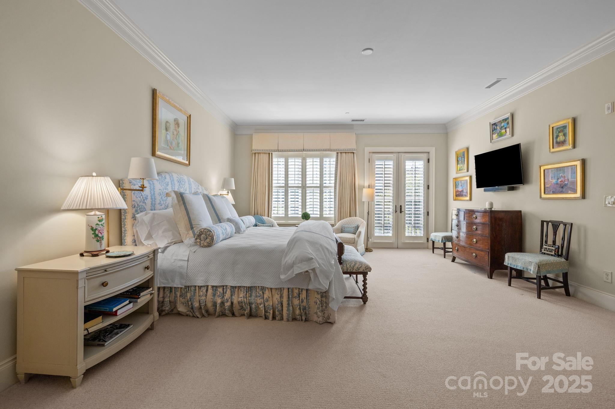 168 Cherokee Road Charlotte, NC 28207 - Photo 24 of 44 a spacious bedroom with a bed and a couch