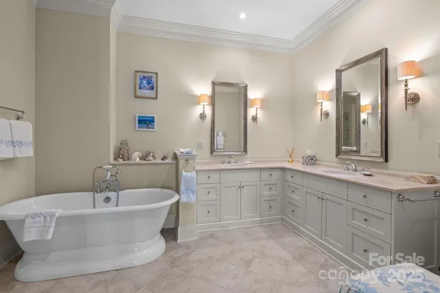 a bathroom with a tub sink and mirror