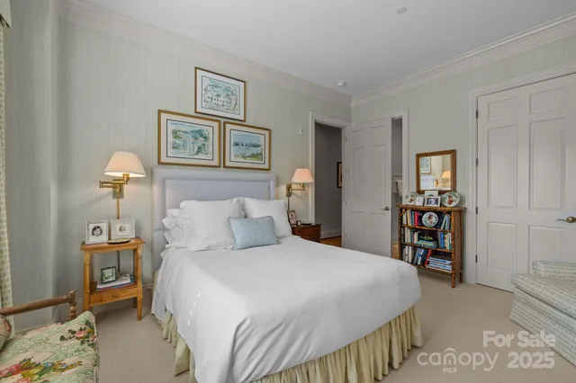 a bedroom with a bed and a view of bathroom