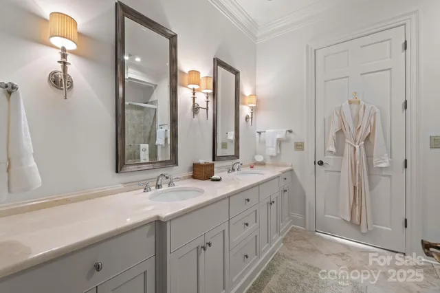 a bathroom with double vanity sink and a mirror
