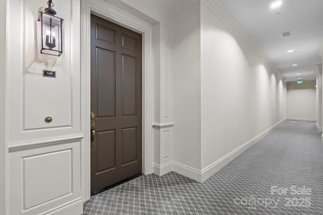 a view of a hallway with front door