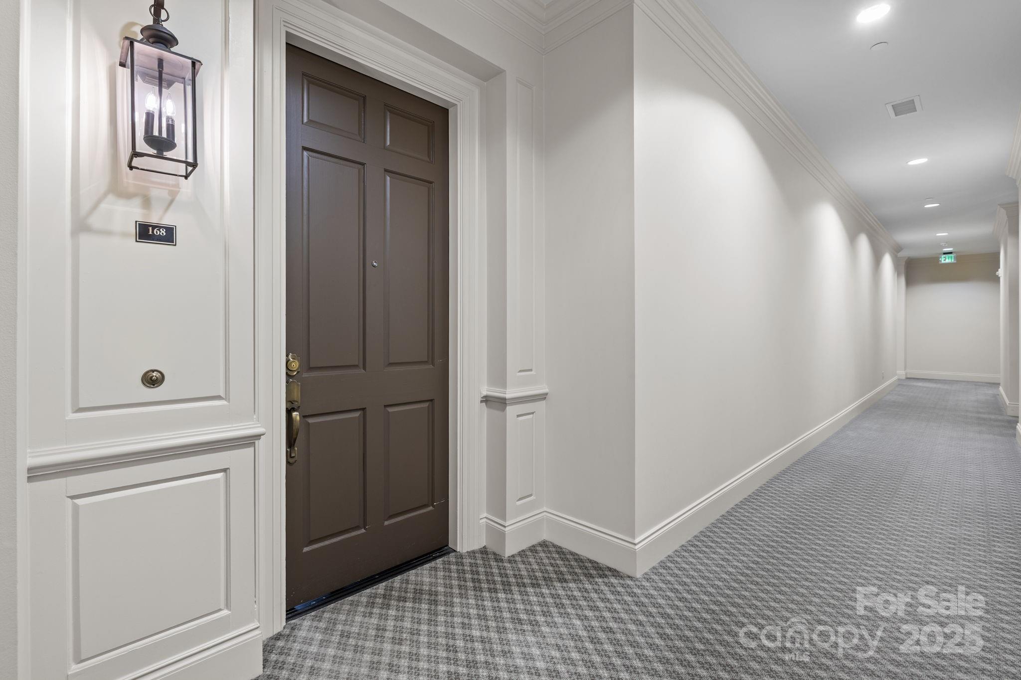 168 Cherokee Road Charlotte, NC 28207 - Photo 5 of 44 a view of a hallway with front door