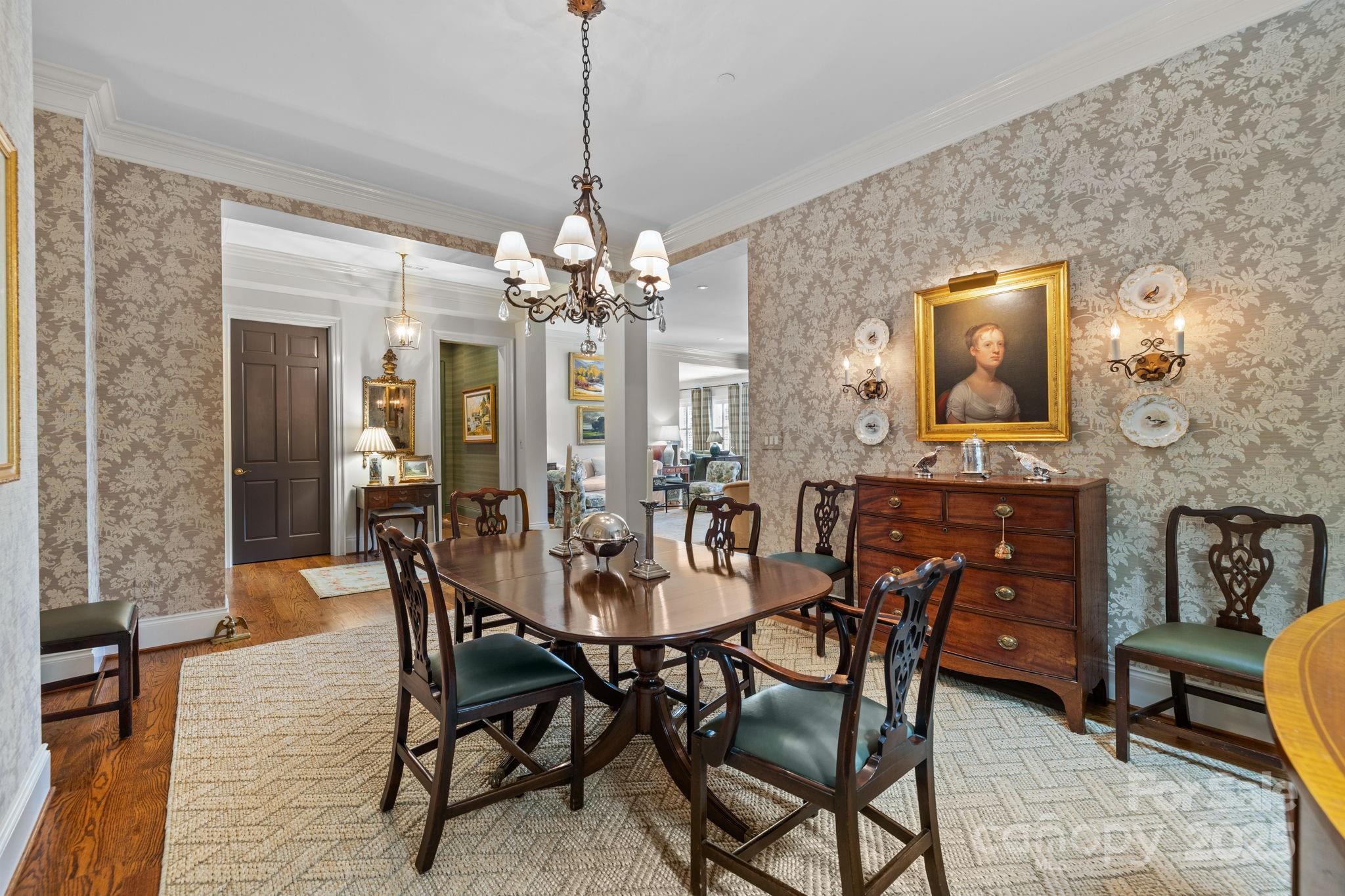 168 Cherokee Road Charlotte, NC 28207 - Photo 7 of 44 a view of a dining room with furniture and chandelier