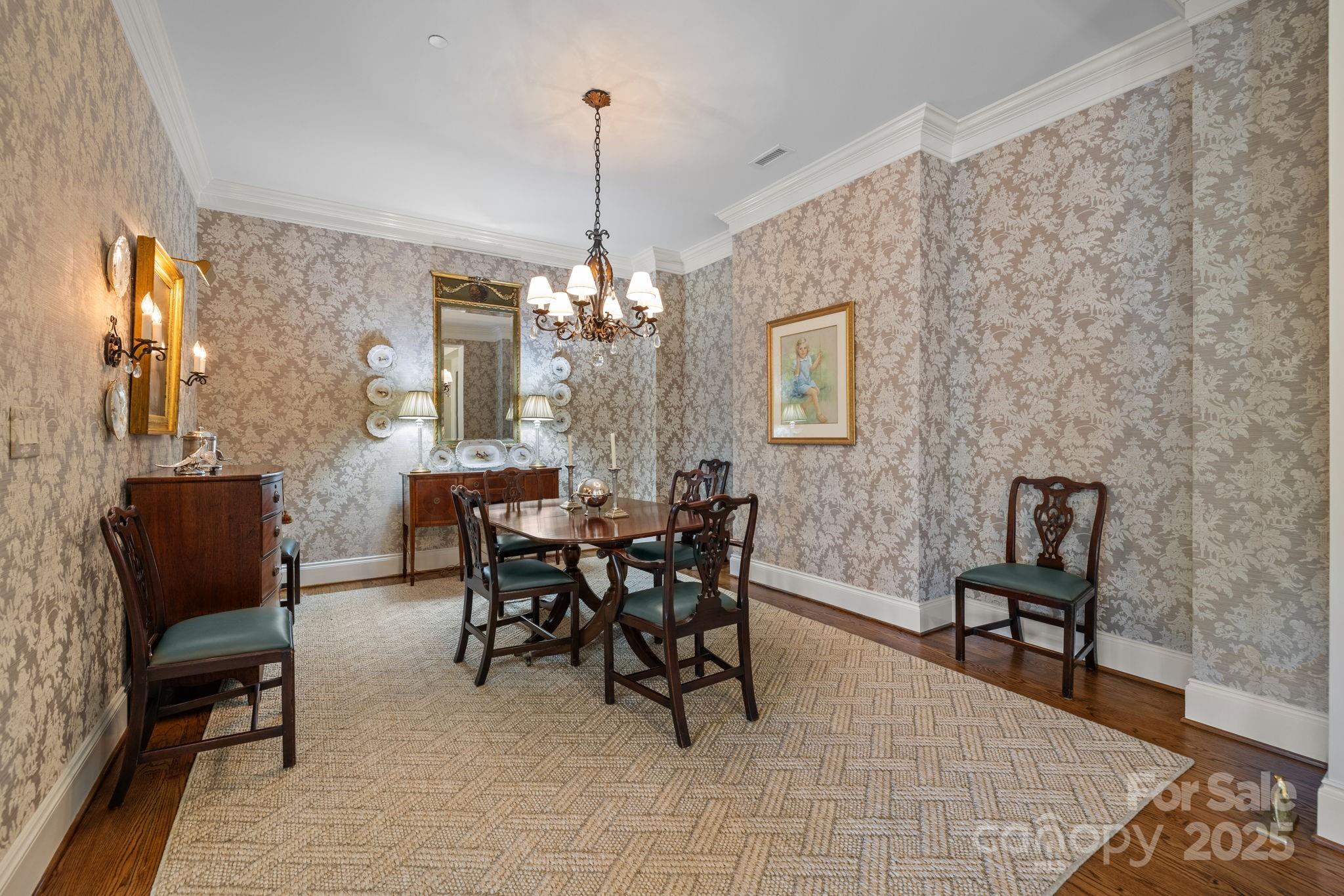 168 Cherokee Road Charlotte, NC 28207 - Photo 8 of 44 a view of a dining room with furniture and chandelier