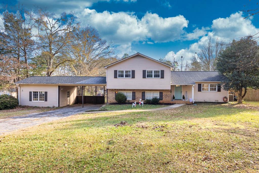 414 Jeffords Road Winder, GA 30680 - Photo 1 of 1 a house view with a garden space