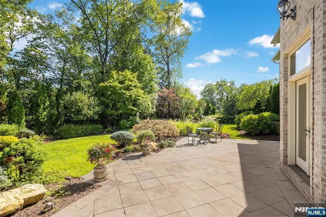 a view of a chair and tables in the garden