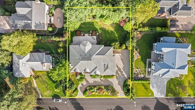 an aerial view of multiple houses with yard