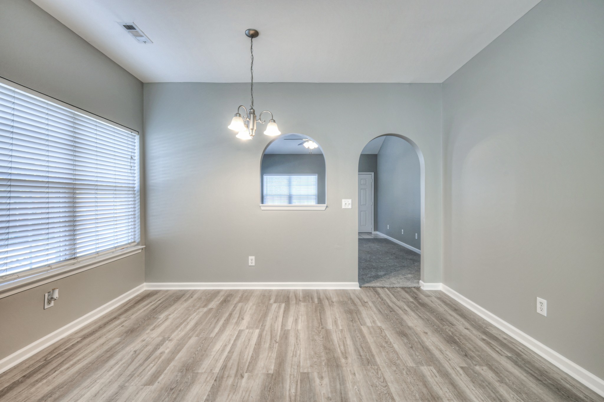 1101 Downs Boulevard, Unit 147 Franklin, TN 37064 - Photo 11 of 26 a view of empty room with wooden floor and fan
