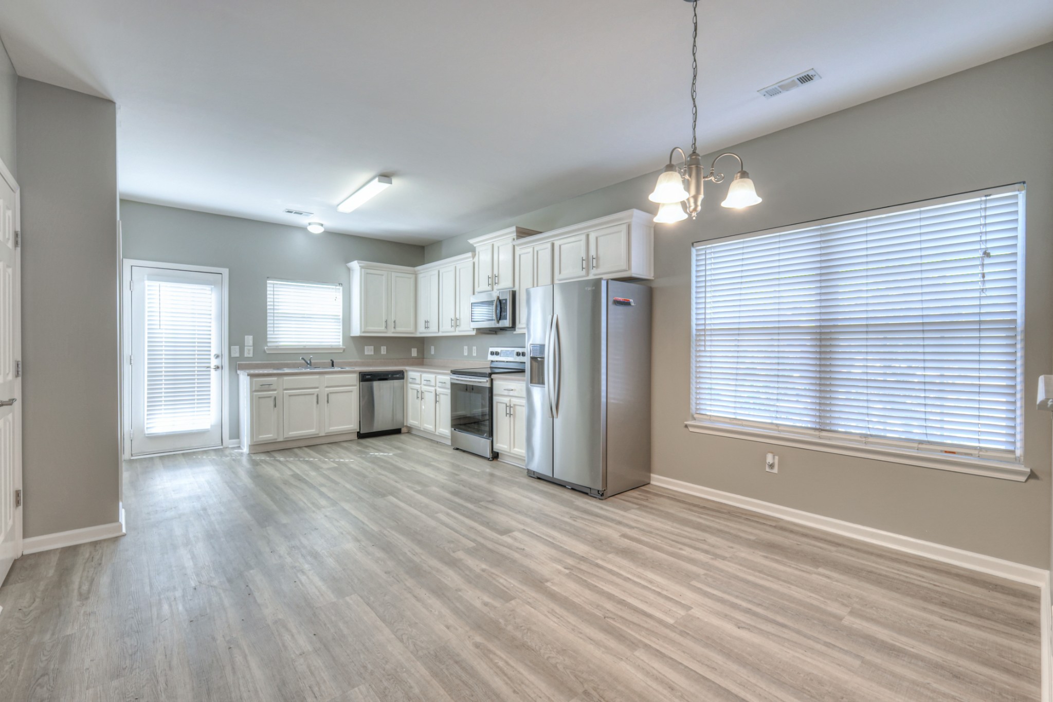 1101 Downs Boulevard, Unit 147 Franklin, TN 37064 - Photo 16 of 26 a view of kitchen with granite countertop cabinets and refrigerator