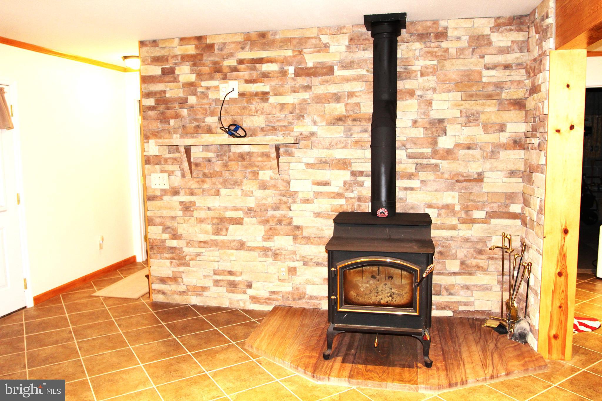 417 Greenwood Ridge Road Accident, MD 21520 - Photo 38 of 91 Bricked Wall, Wood Stove, Stone Hearth