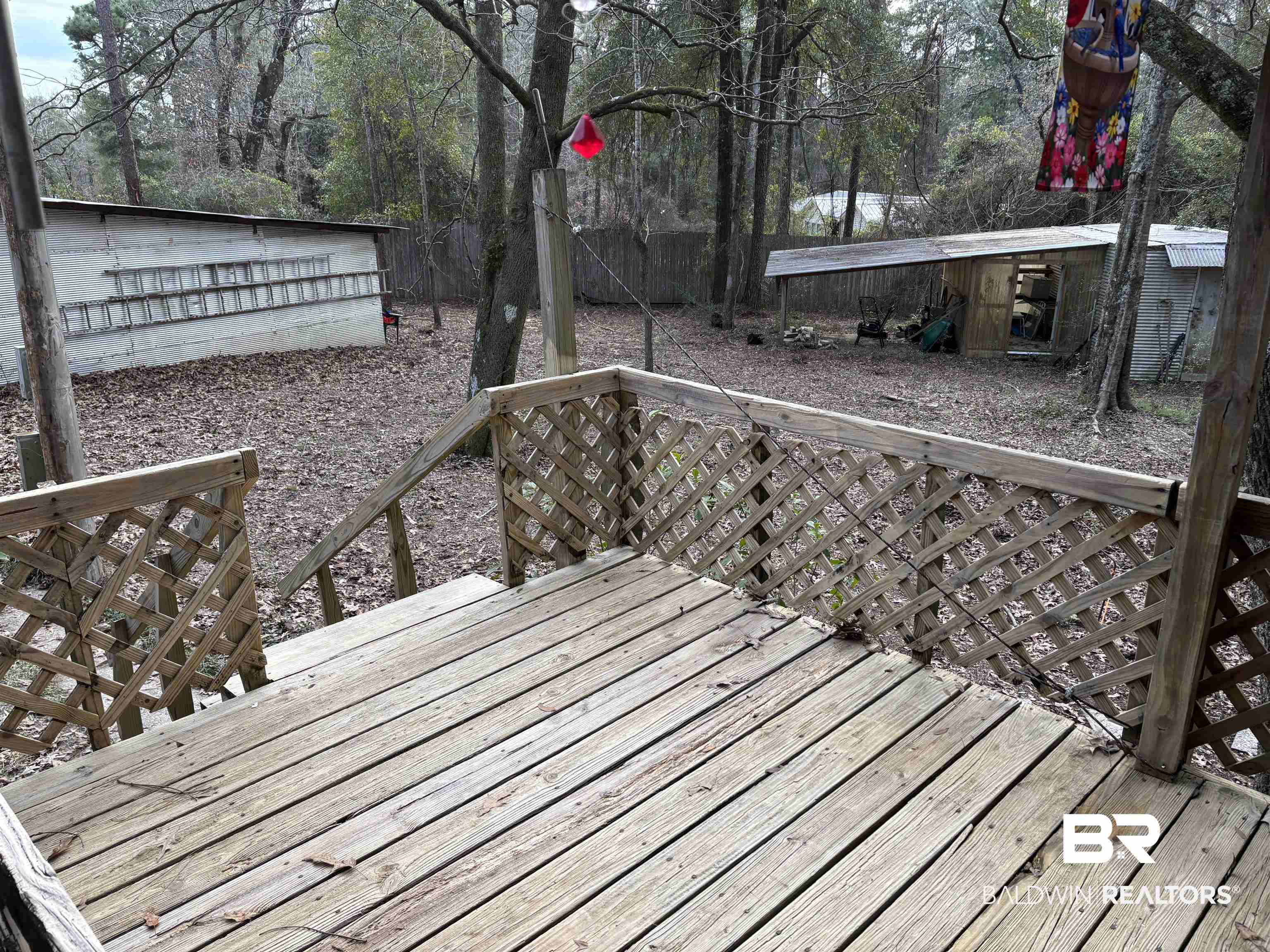 15575 Rogers Drive Chunchula, AL 36521 - Photo 15 of 42 Wooden terrace featuring fence