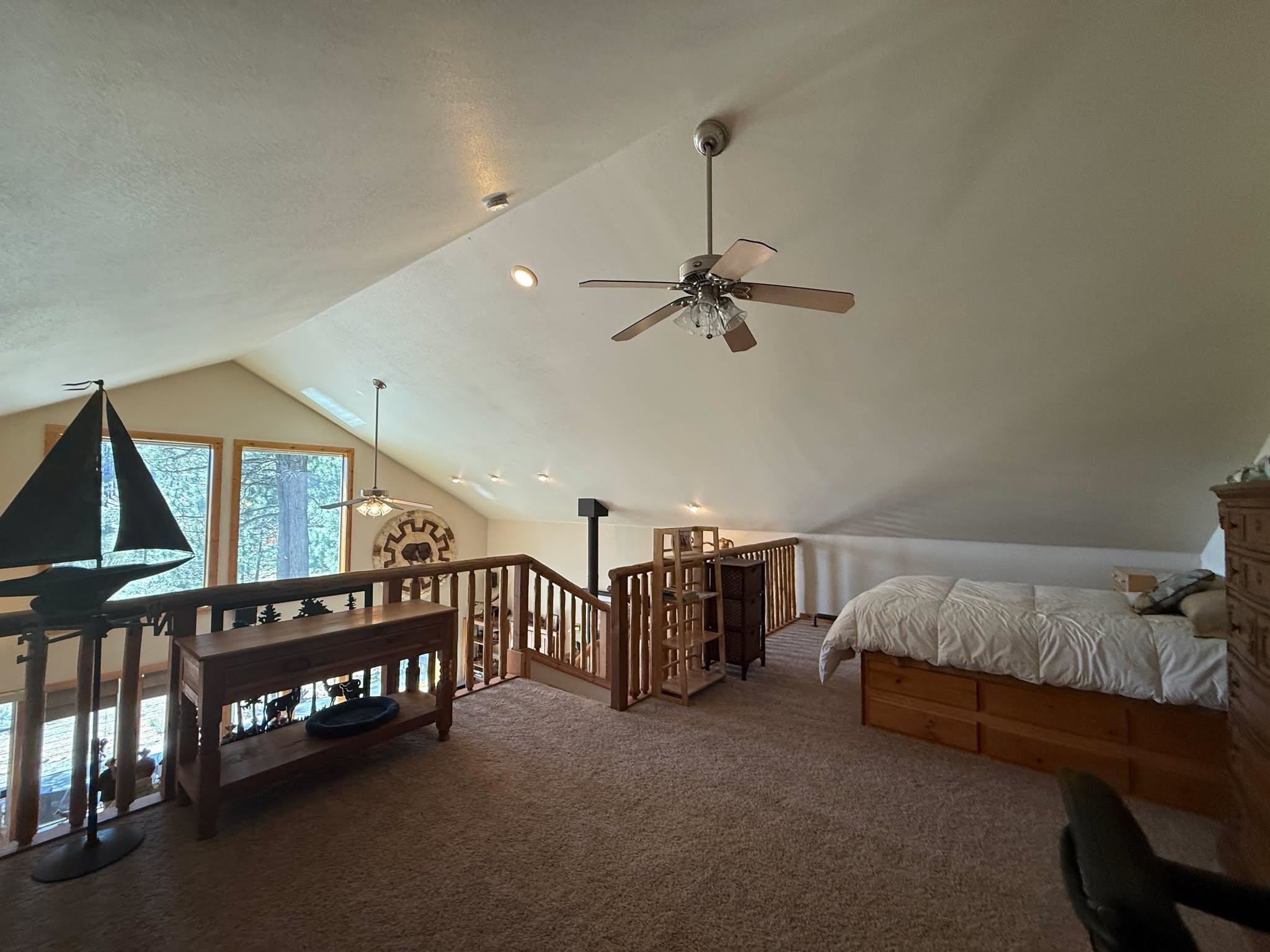 93 Juniper Road Beckwourth, CA 96129 - Photo 13 of 35 a living room with furniture and a chandelier