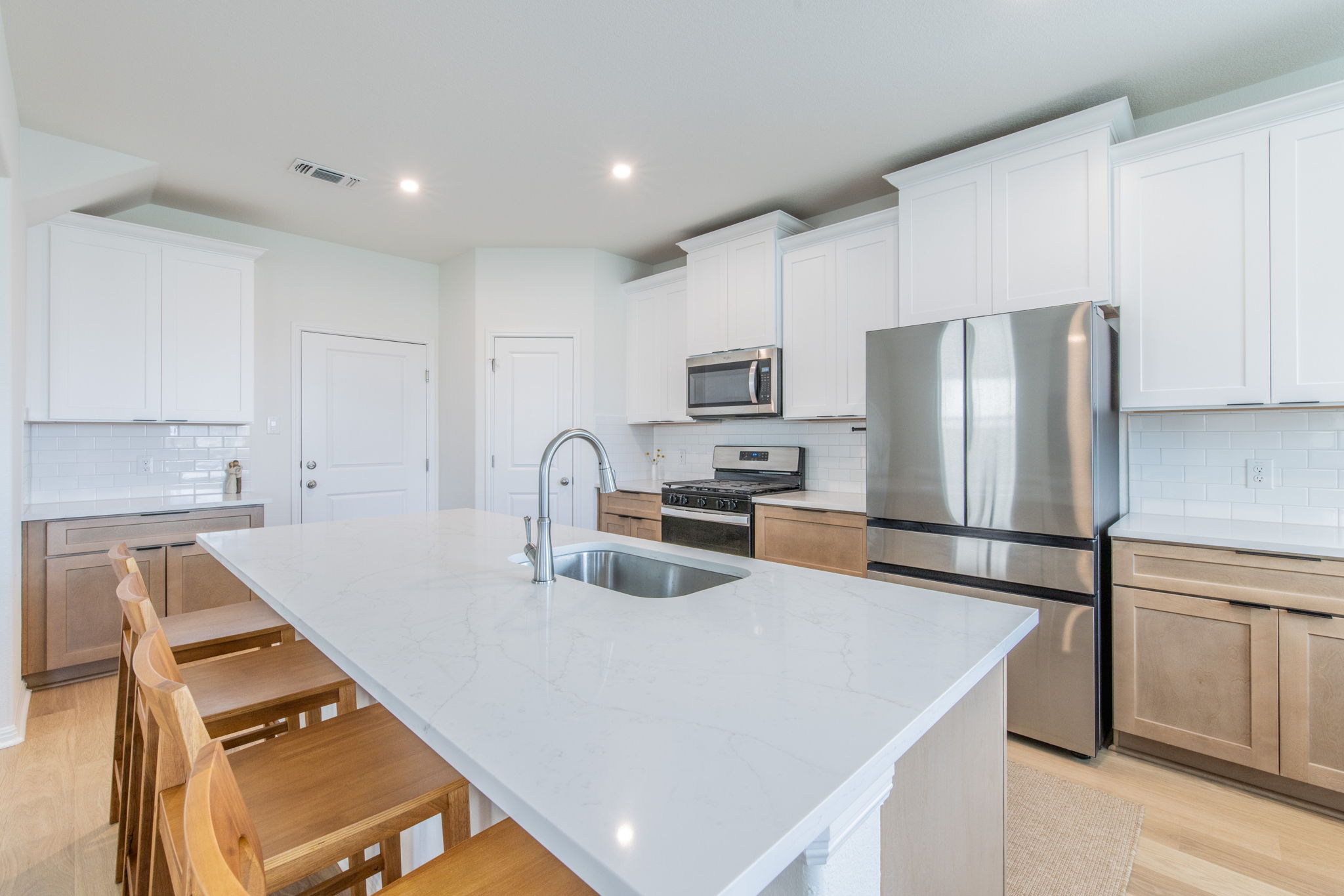 593 Backstays Loop Kyle, TX 78640 - Photo 5 of 26 a kitchen with kitchen island a counter top space stainless steel appliances and cabinets