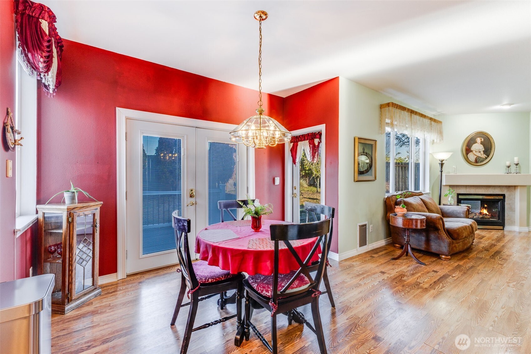 5103 80th Street Southwest Lakewood, WA 98499 - Photo 13 of 33 a dining room with furniture a chandelier and wooden floor