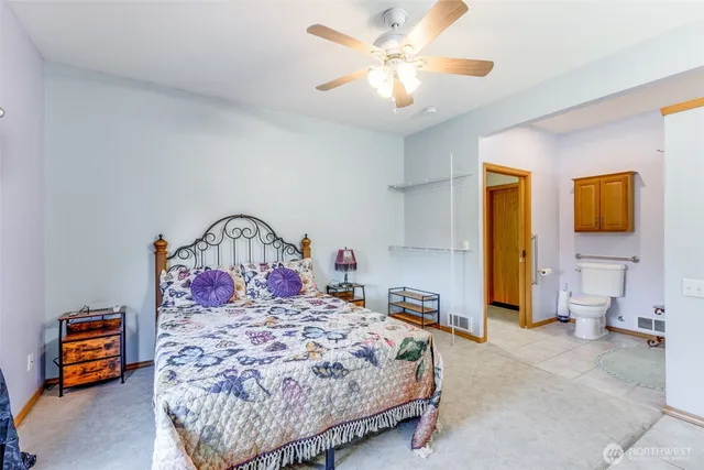 a bed room with a bed and a chandelier