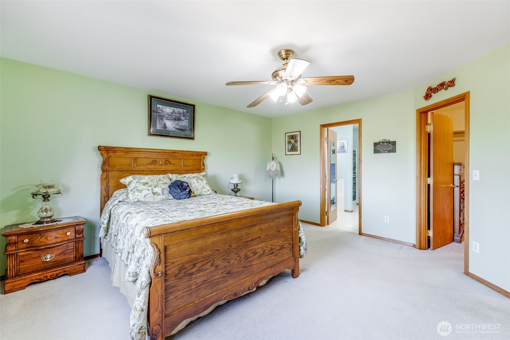 5103 80th Street Southwest Lakewood, WA 98499 - Photo 21 of 33 a bedroom with a bed and a chandelier