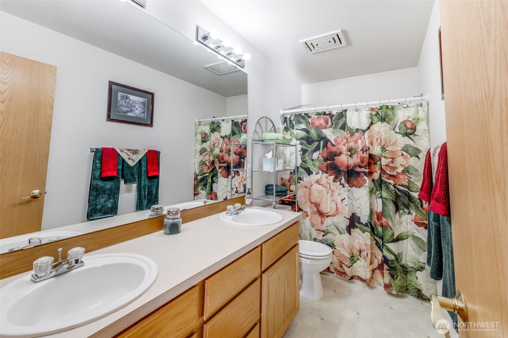 5103 80th Street Southwest Lakewood, WA 98499 - Photo 27 of 33 a bathroom with a sink mirror and vanity