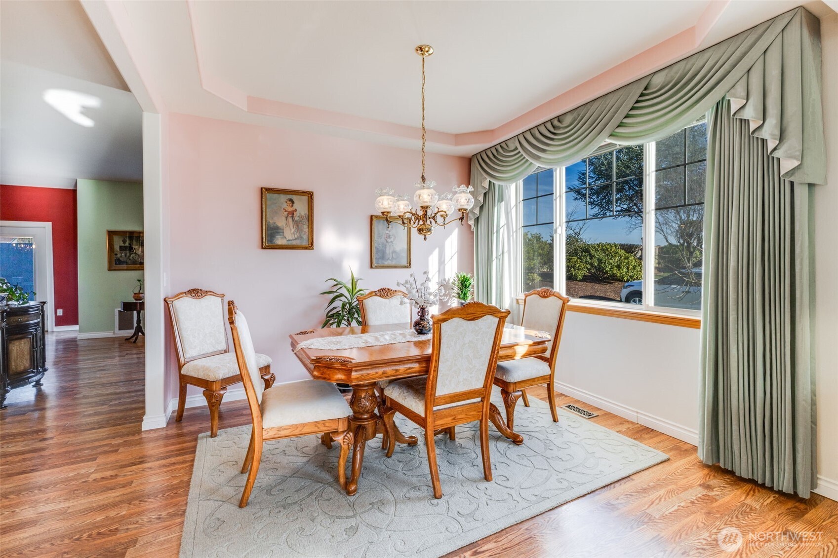 5103 80th Street Southwest Lakewood, WA 98499 - Photo 7 of 33 a dining room with furniture a chandelier and wooden floor