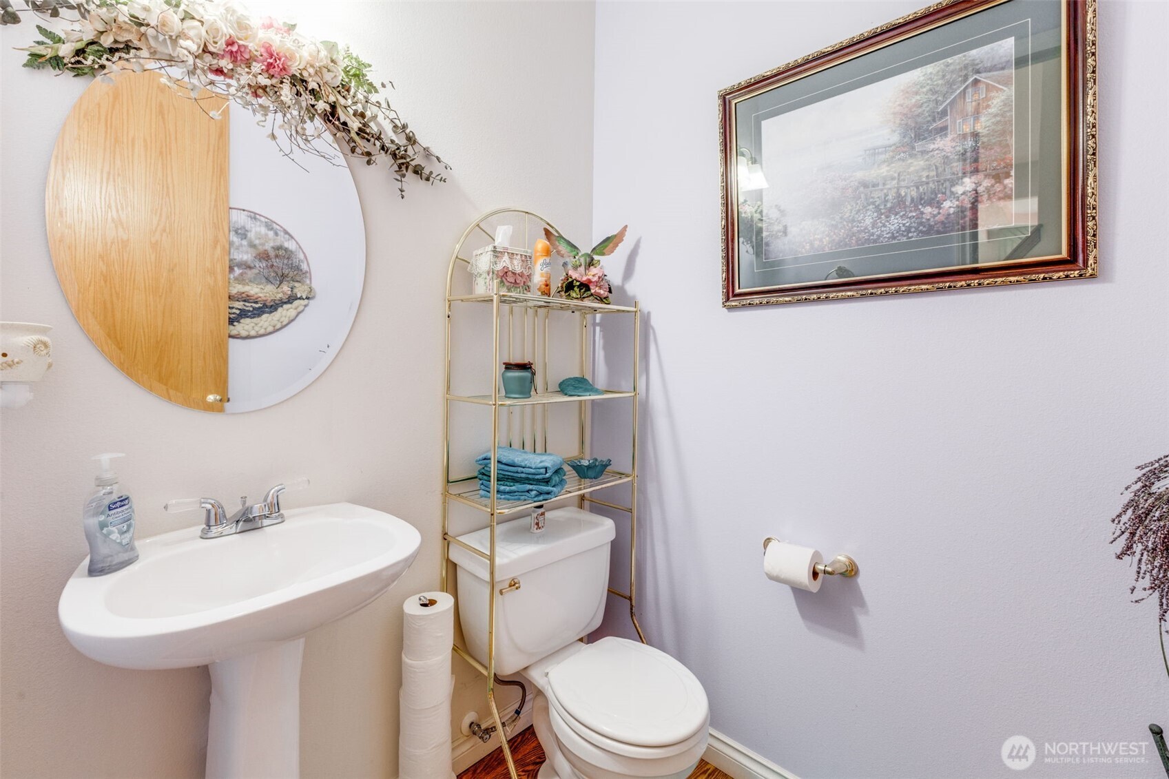 5103 80th Street Southwest Lakewood, WA 98499 - Photo 9 of 33 a bathroom with a toilet a sink and mirror