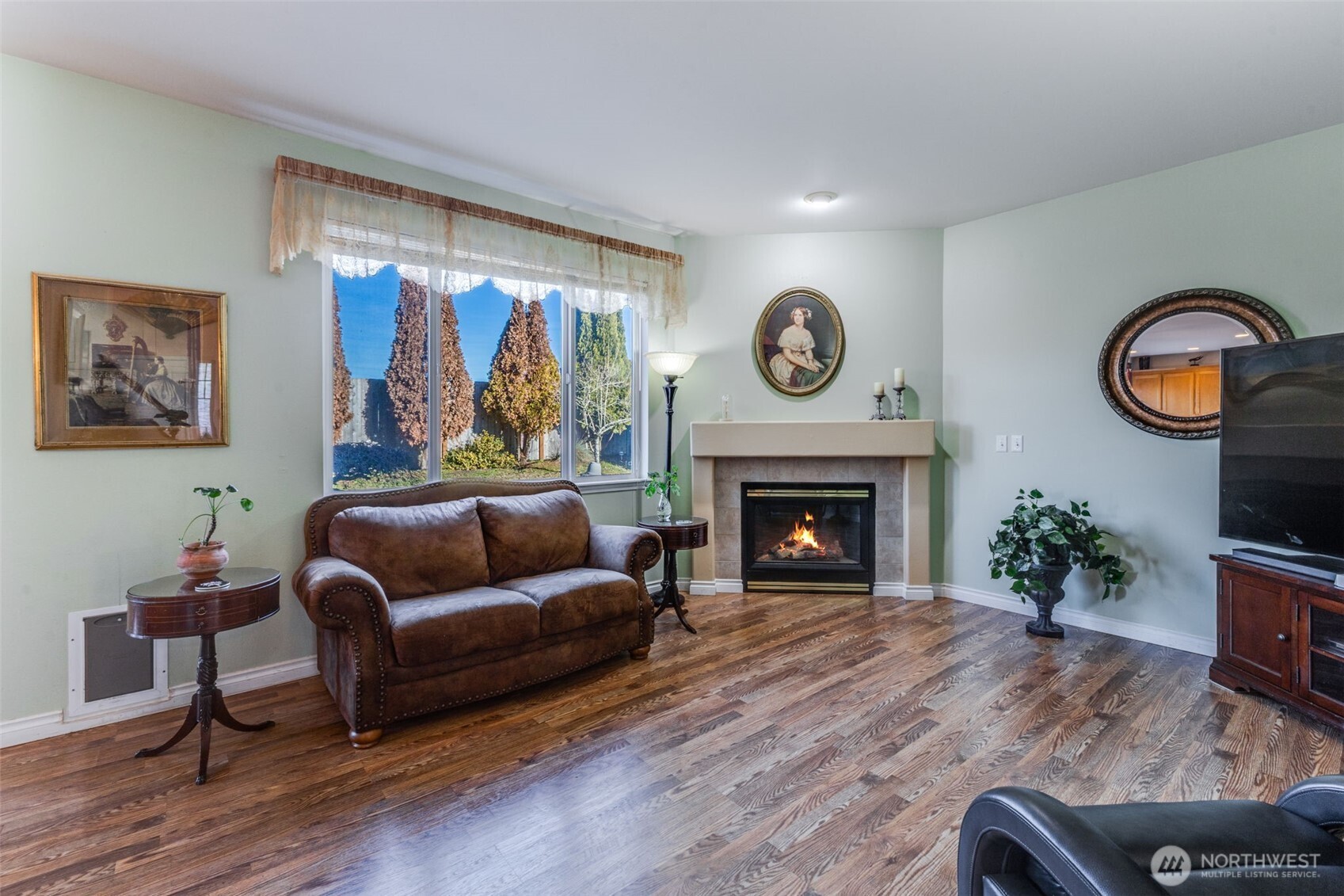 5103 80th Street Southwest Lakewood, WA 98499 - Photo 10 of 33 a living room with furniture and a fireplace