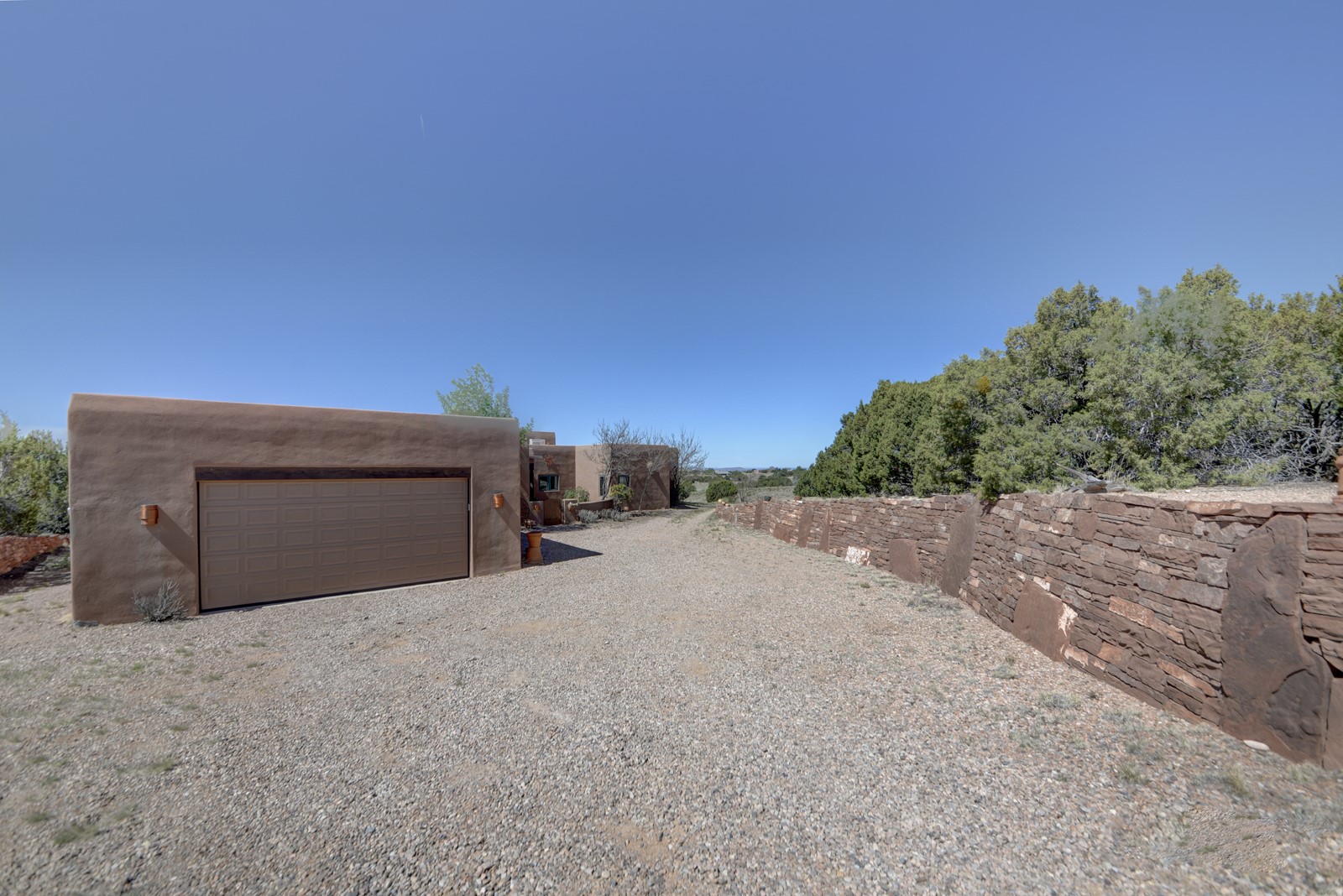 47 Azul Loop Santa Fe, NM 87508 - Photo 2 of 36 Driveway and wall.