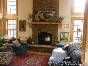 81 Rugged Cross Ridge Clyde, NC 28721 - Photo 3 of 12 a living room with furniture and a fireplace