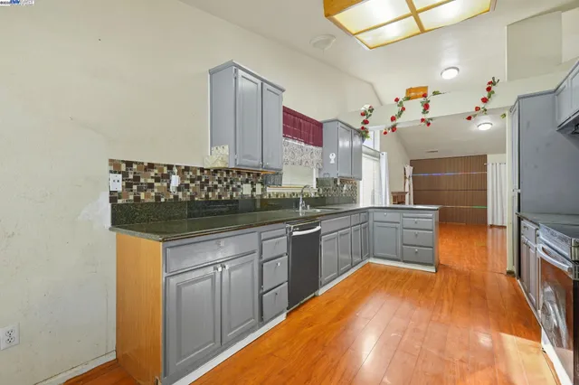 a dining room with furniture and a window