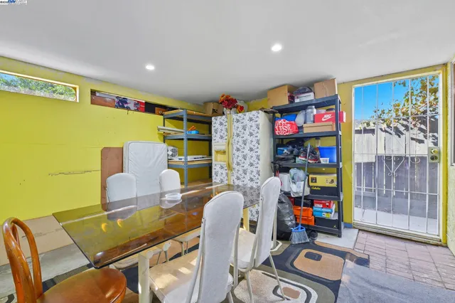a view of entryway with wooden floor and livingroom view