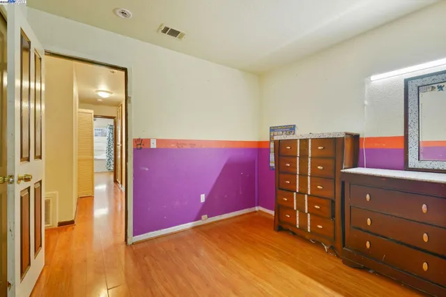 a view of a livingroom with wooden floor