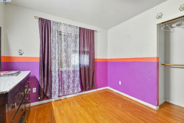 a room with a dresser and a dresser