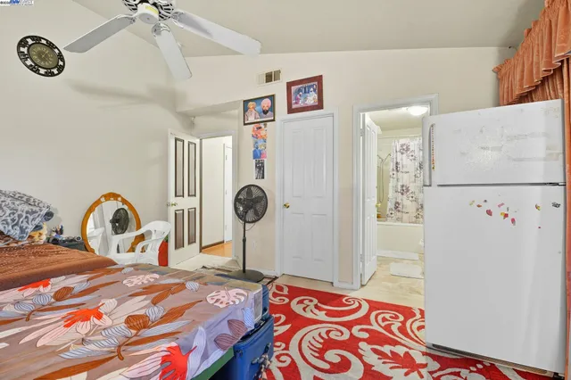 a bedroom with a bed dresser and a window