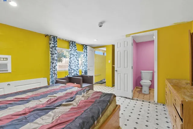 a bedroom with a bed and cabinets