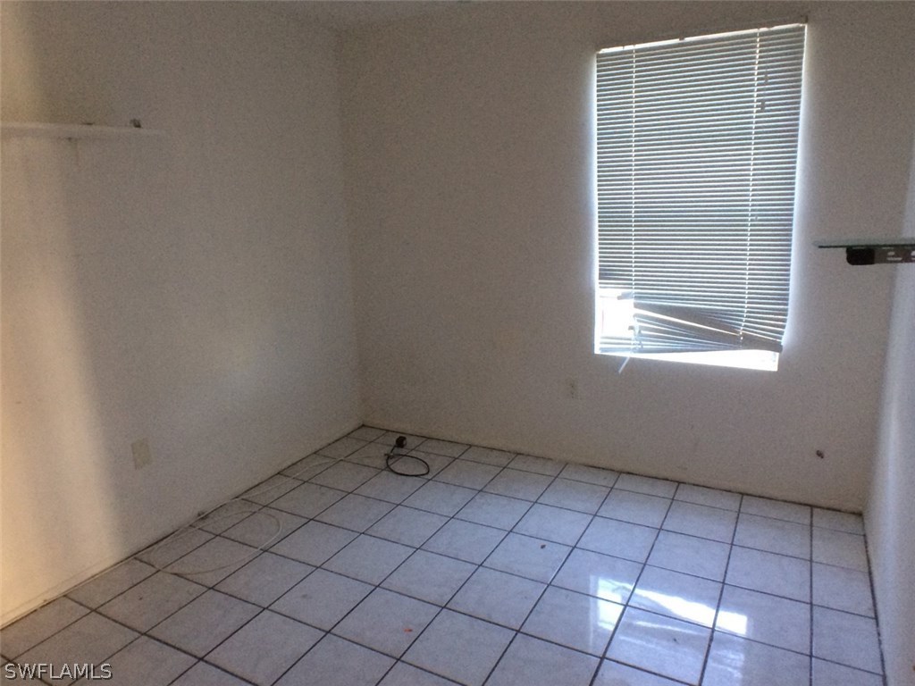 18250 Apple Road Fort Myers, FL 33967 - Photo 15 of 19 a view of an empty room with a window
